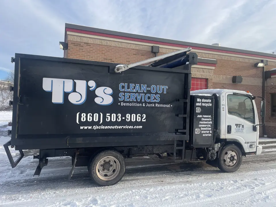 A TJ's Clean-Out Services truck